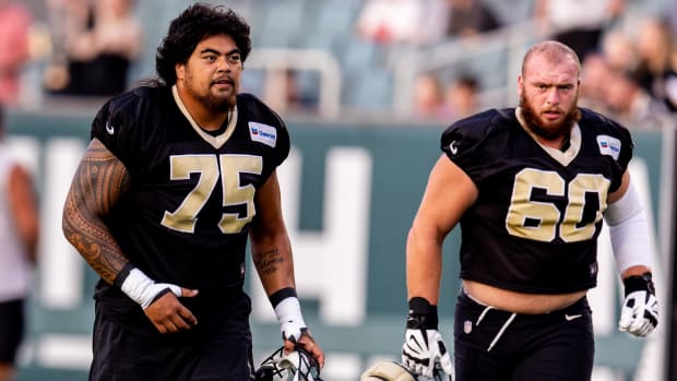 New Orleans Saints offensive linemen Taliese Fuaga (75) and Kyle Hergel (60) during practice at Yulman Stadium  