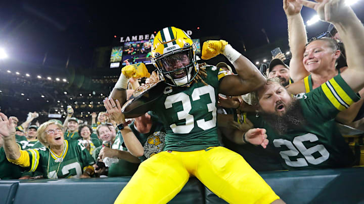 Green Bay Packers running back Aaron Jones celebrates with fans after scoring a touchdown against the Chicago Bears in 2022. Green Bay Packers running back Aaron Jones celebrates with fans after scoring a touchdown against the Chicago Bears in 2022.