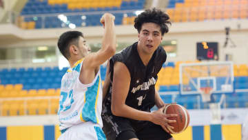 Akhan Mukhazhanov (L) of Kazakhstan Basketball team and...