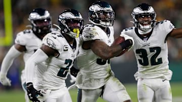 Former Philadelphia Eagles outside linebacker Nigel Bradham (53) celebrates his fourth-quarter interception with Malcolm Jenkins (27) and Rasul Douglas (32) against the Green Bay Packers at Lambeau Field in Green Bay, Wis.