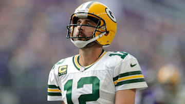 Former Green Bay Packers quarterback Aaron Rodgers (12) reacts after wide receiver Christian Watson (9) dropped a wide-open long pass at U.S. Bank Stadium.