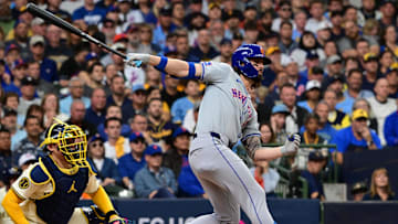 Oct 1, 2024; Milwaukee, Wisconsin, USA; New York Mets outfielder Jesse Winker (3) hits a two run triple against the Milwaukee Brewers during the second inning in game one of the Wildcard round for the 2024 MLB Playoffs at American Family Field. Mandatory Credit: Benny Sieu-Imagn Images