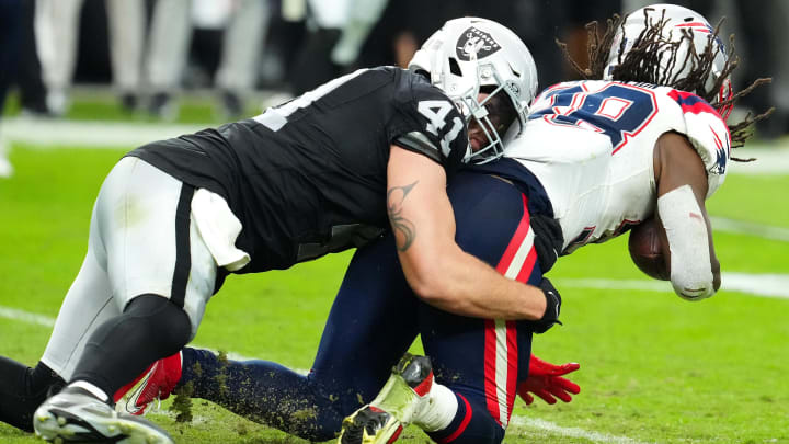 Oct 15, 2023; Paradise, Nevada, USA; Las Vegas Raiders linebacker Robert Spillane (41) tackles New England Patriots wide receiver Matthew Slater (18) during the fourth quarter at Allegiant Stadium. Mandatory Credit: Stephen R. Sylvanie-USA TODAY Sports