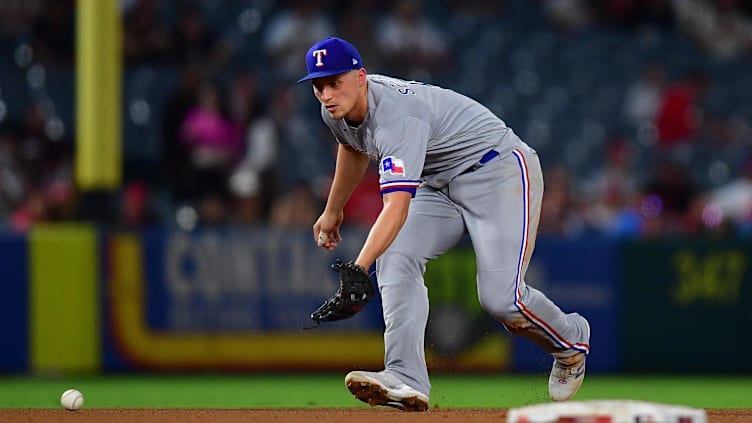 Sep 26, 2023; Anaheim, California, USA;  Texas Rangers shortstop Corey Seager (5) fields the ground