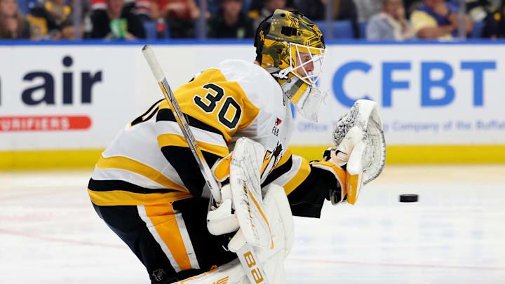 Sep 21, 2024; Buffalo, New York, USA;  Pittsburgh Penguins goalie Joel Blomqvist (30) looks to make a save during the second period against the Buffalo Sabres at KeyBank Center.