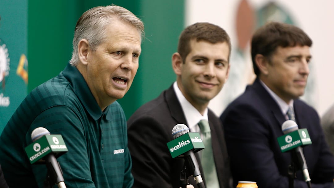 Jul 5, 2013; Waltham, MA, USA; General Manager Danny Ainge talks about hiring new Boston Celtics head coach Brad Stevens, center, as owner Wyc Grousbeck, right, listens in during a news conference announcing Stevens new position. Mandatory Credit: Winslow Townson-Imagn Images