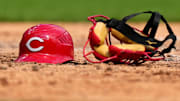 Cincinnati Reds catcher Austin Romine   s (28) helmet and mask rest in the dirt in the seventh of a baseball game against the Pittsburgh Pirates, Wednesday, Sept. 14, 2022, at Great American Ball Park in Cincinnati.

Mlb Pittsburgh Pirates At Cincinnati Reds Sept 14 7830