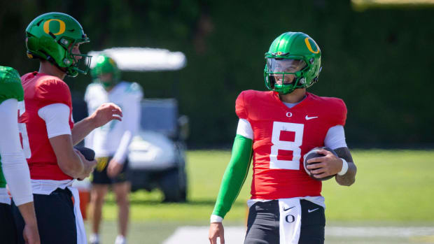 Oregon quarterback Dillon Gabriel walks the field during practice with the Ducks Tuesday,