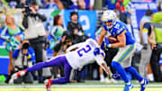 Nov 30, 2025; Seattle, Washington, USA; Seattle Seahawks wide receiver Cooper Kupp (10) stiff arms Minnesota Vikings cornerback Isaiah Rodgers (2) during the first half against the Minnesota Vikings at Lumen Field. Mandatory Credit: Steven Bisig-Imagn Images