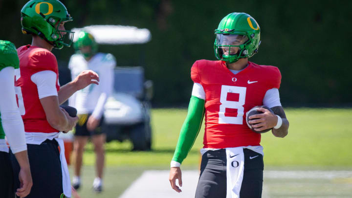 Oregon quarterback Dillon Gabriel walks the field during practice with the Ducks Tuesday, Aug. 13, 2024 at the Hatfield-Dowlin Complex in Eugene, Ore.