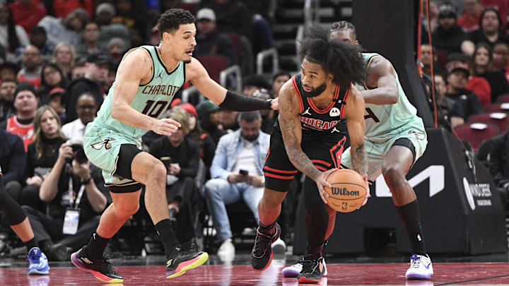 Dec 13, 2024; Chicago, Illinois, USA; Chicago Bulls guard Coby White (0) passes the ball