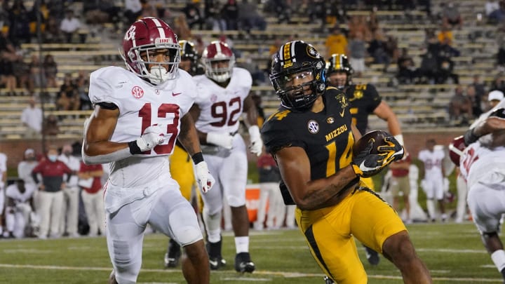 Sep 26, 2020; Columbia, Missouri, USA; Missouri Tigers wide receiver Dominic Gicinto (14) runs the ball as Alabama Crimson Tide defensive back Malachi Moore (13) chases during the game at Faurot Field at Memorial Stadium. Mandatory Credit: Denny Medley-USA TODAY Sports