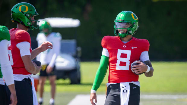 Oregon quarterback Dillon Gabriel walks the field during practice with the Ducks 