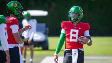 Oregon quarterback Dillon Gabriel walks the field during practice with the Ducks Tuesday, Aug. 13, 2024 at the Hatfield-Dowlin Complex in Eugene, Ore.