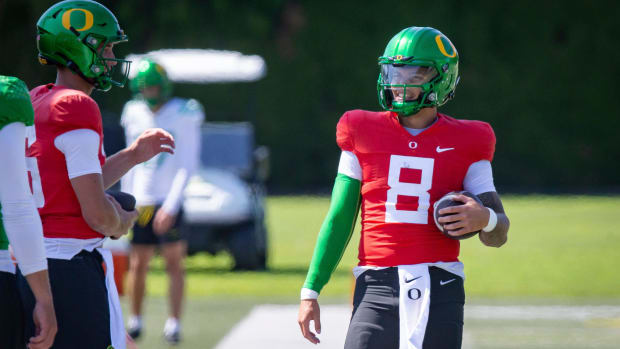 Oregon quarterback Dillon Gabriel walks the field during practice with the Ducks 