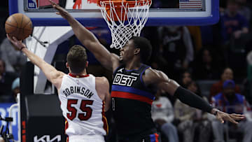 Former Miami Heat forward Duncan Robinson (55) shoots on Detroit Pistons center Jalen Duren (0) in the second half at Little Caesars Arena.