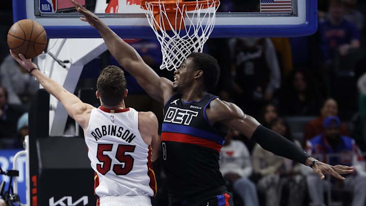 Former Miami Heat forward Duncan Robinson (55) shoots on Detroit Pistons center Jalen Duren (0) in the second half at Little Caesars Arena.