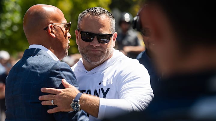 Penn State athletic director Pat Kraft greets head football coach James Franklin