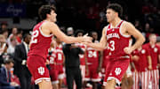 Indiana's Trey Galloway (32) and Anthony Leal (3) celebrate against  Ohio State at Value City Arena. 