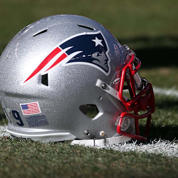 January 19, 2014; Denver, CO, USA; New England Patriots helmet on field before the 2013 AFC Championship football game  against the Denver Broncos at Sports Authority Field at Mile High. Mandatory Credit: Mark J. Rebilas-Imagn Images