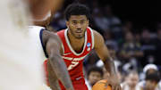 Mar 21, 2025; Cleveland, OH, USA;  New Mexico Lobos guard Donovan Dent (2) dribbles in the second half against the Marquette Golden Eagles during the NCAA Tournament First Round at Rocket Arena. Mandatory Credit: Rick Osentoski-Imagn Images