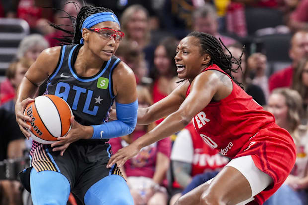 Indiana Fever guard Kelsey Mitchell (0) guards Atlanta Dream guard Allisha Gray (15)