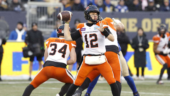 Nov 13, 2022; Winnigeg, Manitoba, CAN; BC Lions quarterback Nathan Rourke (12) gets set to make a pass against the Winnipeg Blue Bombers at Investors Group Field. Mandatory Credit: James Carey Lauder-Imagn Images Nov 13, 2022; Winnigeg, Manitoba, CAN; BC Lions quarterback Nathan Rourke (12) gets set to make a pass against the Winnipeg Blue Bombers at Investors Group Field. Mandatory Credit: James Carey Lauder-Imagn Images