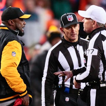 Jan 17, 2016; Denver, CO, USA; Pittsburgh Steelers head coach Mike Tomlin looks to make a challenge call with referee Terry McAulay (77) in the fourth quarter against the Denver Broncos in an AFC Divisional round playoff game at Sports Authority Field at Mile High. Mandatory Credit: Isaiah J. Downing-Imagn Images