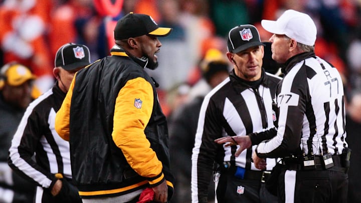 Jan 17, 2016; Denver, CO, USA; Pittsburgh Steelers head coach Mike Tomlin looks to make a challenge call with referee Terry McAulay (77) in the fourth quarter against the Denver Broncos in an AFC Divisional round playoff game at Sports Authority Field at Mile High. Mandatory Credit: Isaiah J. Downing-Imagn Images