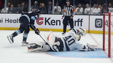 Sep 23, 2024; Salt Lake City, Utah, USA; Los Angeles Kings goaltender Carter George} (40) blocks the shot of Utah Hockey Club forward Matias Maccelli (63) during a shootout at Delta Center. Mandatory Credit: Rob Gray-Imagn Images