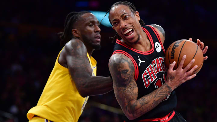 Jan 25, 2024; Los Angeles, California, USA; Chicago Bulls forward DeMar DeRozan (11) moves the ball ahead of Los Angeles Lakers forward Taurean Prince (12) during the second half at Crypto.com Arena. Mandatory Credit: Gary A. Vasquez-USA TODAY Sports