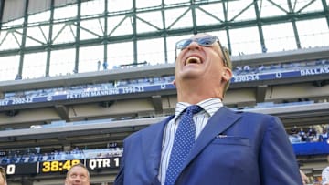 Peyton Manning talks with Bill Polian on Sunday, Sept. 7, 2025, ahead of the game at Lucas Oil Stadium in Indianapolis.
