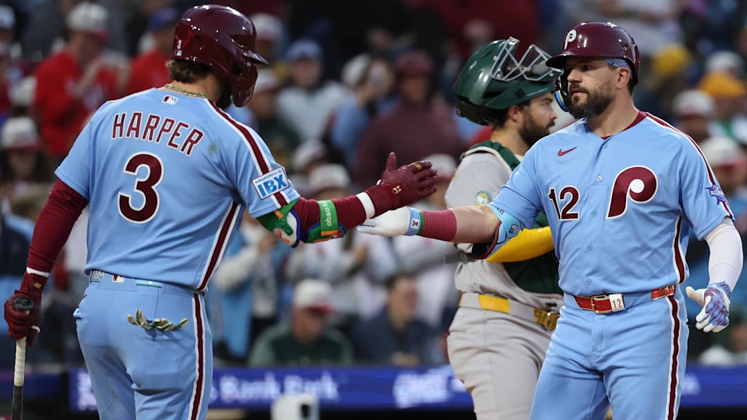 May 7, 2026; Philadelphia, Pennsylvania, USA; Philadelphia Phillies left fielder Kyle Schwarber (12) is congratulated by first baseman Bryce Harper (3) after hitting a home run against the Athletics at Citizens Bank Park.