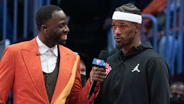 February 20, 2022; Cleveland, Ohio, USA; Team Durant forward Draymond Green of the Golden State Warriors (23, left) interviews Team LeBron forward Jimmy Butler of the Miami Heat (22) during the fourth quarter in the 2022 NBA All-Star Game at Rocket Mortgage FieldHouse. Mandatory Credit: Kyle Terada-Imagn Images