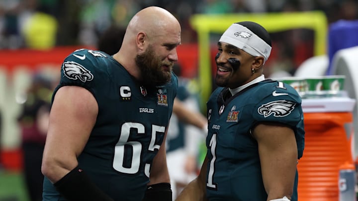 Philadelphia Eagles quarterback Jalen Hurts celebrates with Lane Johnson during the fourth quarter of Super Bowl LIX.