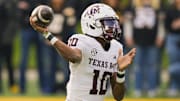 Texas A&M is a short favorite against Texas in college football Week 14 action.