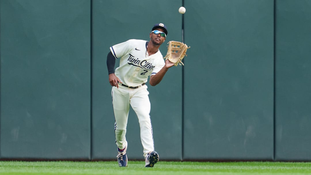 Sep 24, 2023; Minneapolis, Minnesota, USA; Minnesota Twins center fielder Michael A. Taylor (2) catches a fly ball to retire Los Angeles Angels left fielder Randal Grichuk (15) in the first inning at Target Field. Mandatory Credit: Matt Blewett-Imagn Images