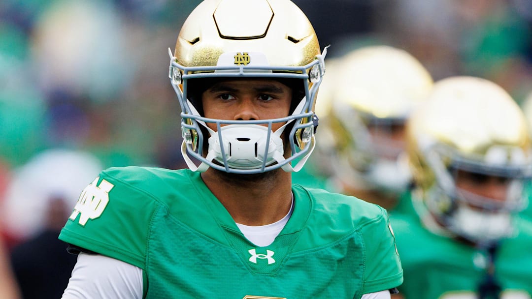Notre Dame quarterback Kenny Minchey (8) warms up before a NCAA college football game between Notre Dame and Louisville at Notre Dame Stadium on Saturday, Sept. 28, 2024, in South Bend.