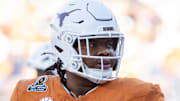 Dec 21, 2024; Austin, Texas, USA; Texas Longhorns offensive lineman Andre Cojoe (77) against the Clemson Tigers during the CFP National playoff first round at Darrell K Royal-Texas Memorial Stadium. Mandatory Credit: Mark J. Rebilas-Imagn Images