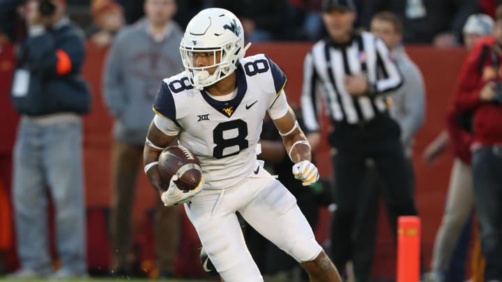 Oct 13, 2018; Ames, IA, USA; West Virginia Mountaineers wide receiver Marcus Simms (8) runs the football against the Iowa State Cyclones at Jack Trice Stadium.