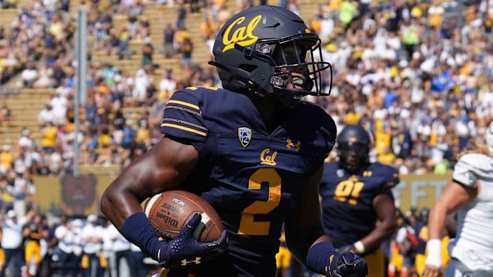Sep 3, 2022; Berkeley, California, USA; California Golden Bears safety Craig Woodson (2) returns an interception for a touchdown against the UC Davis Aggies during the third quarter at FTX Field at California Memorial Stadium. Mandatory Credit: Darren Yamashita-Imagn Images