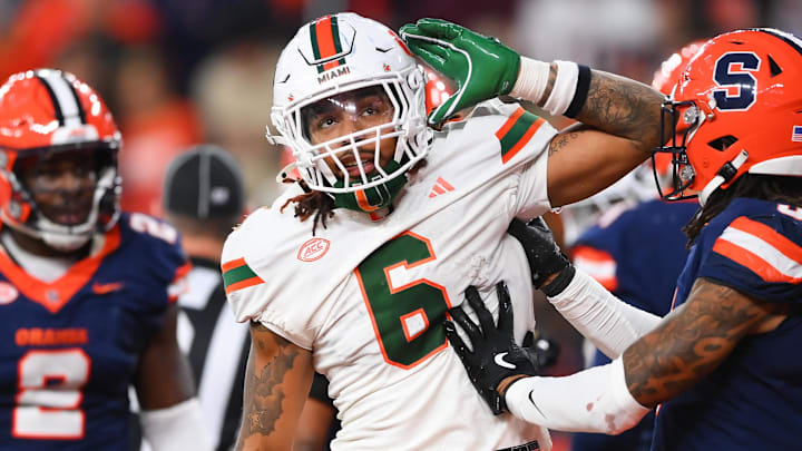 Nov 30, 2024; Syracuse, New York, USA; Miami Hurricanes running back Damien Martinez (6) gestures to fans after running for a touchdown against the Syracuse Orange during the second half at the JMA Wireless Dome.
