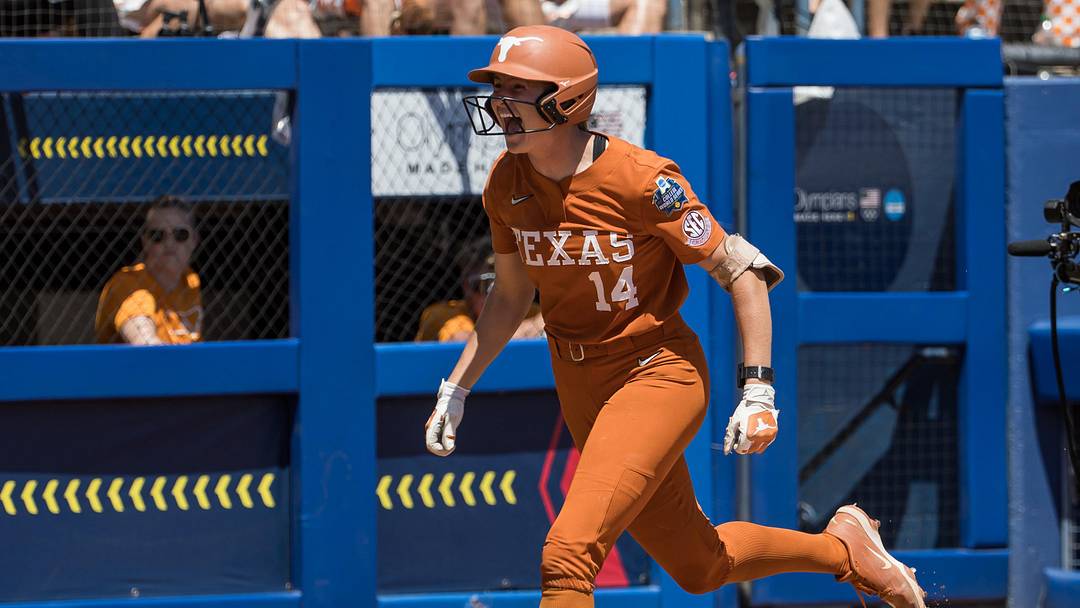Texas Longhorns catcher Reese Atwood (14) yells as she heads towards home plate after hitting a solo home run in the fourth inning against the Tennessee Lady Volunteers.