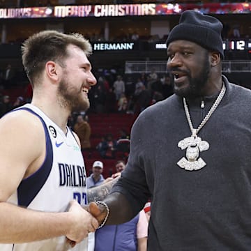 Dec 23, 2022; Houston, Texas, USA; Dallas Mavericks guard Luka Doncic (77) greets Shaquille O'Neal after the game against the Houston Rockets at Toyota Center. Mandatory Credit: Troy Taormina-Imagn Images