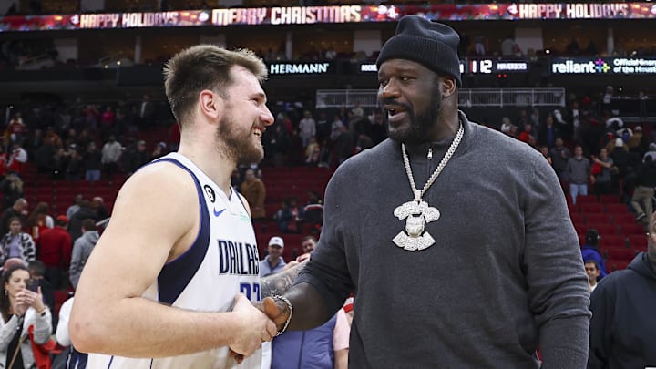 Dec 23, 2022; Houston, Texas, USA; Dallas Mavericks guard Luka Doncic (77) greets Shaquille O'Neal after the game against the Houston Rockets at Toyota Center. Mandatory Credit: Troy Taormina-Imagn Images