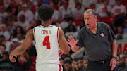 Houston coach Kelvin Sampson (right) congratulates guard LJ Cryer during a recent game.