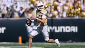 Oct 25, 2025; Atlanta, Georgia, USA; Georgia Tech Yellow Jackets quarterback Haynes King (10) scrambles against the Syracuse Orange in the second quarter at Bobby Dodd Stadium at Hyundai Field. Mandatory Credit: Brett Davis-Imagn Images
