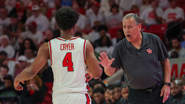 Houston coach Kelvin Sampson (right) congratulates guard LJ Cryer during a recent game.