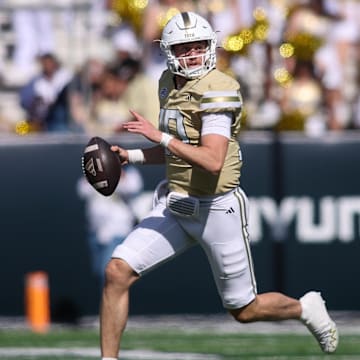 Oct 25, 2025; Atlanta, Georgia, USA; Georgia Tech Yellow Jackets quarterback Haynes King (10) scrambles against the Syracuse Orange in the second quarter at Bobby Dodd Stadium at Hyundai Field. Mandatory Credit: Brett Davis-Imagn Images
