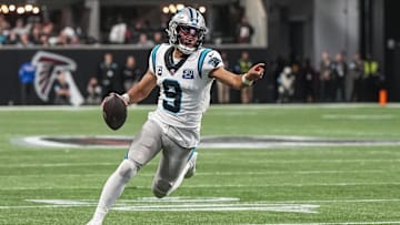 Jan 5, 2025; Atlanta, Georgia, USA; Carolina Panthers quarterback Bryce Young (9) runs for a touchdown against the Atlanta Falcons during the second half at Mercedes-Benz Stadium.
